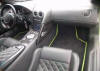 photo of lamborghini dash, steering wheel and front leather seats.